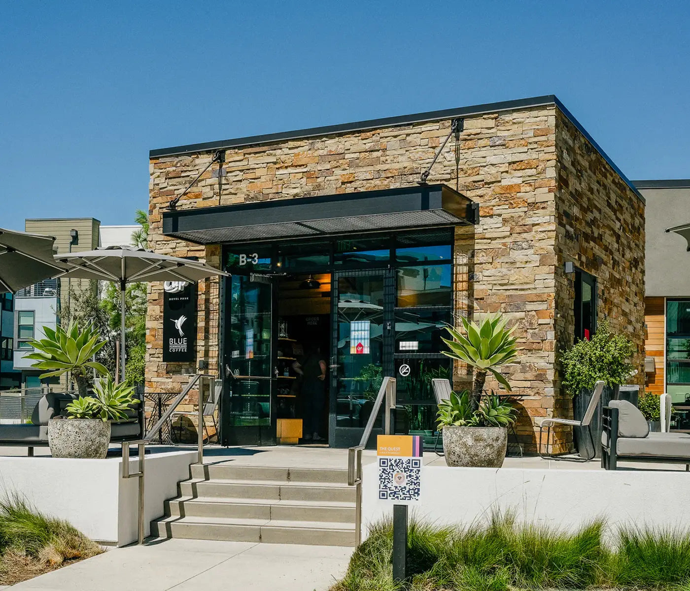 Outdoor seating at Cup by Blue Hummingbird coffee shop in Great Park, Irvine 